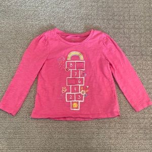 Hopscotch shirt with two peekaboo flaps